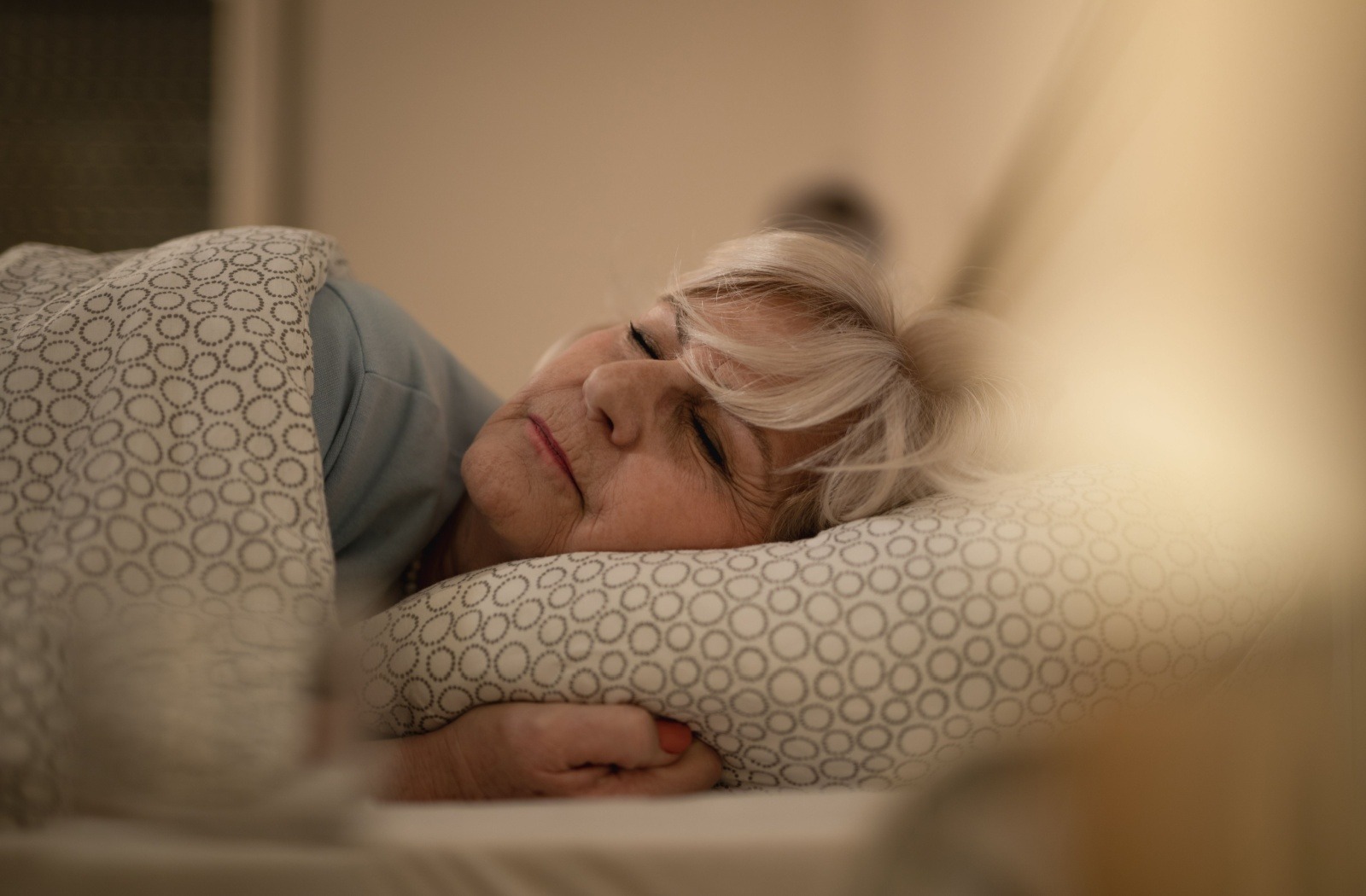 A senior sleeps soundly, after making lifestyle changes to improve their sleep.
