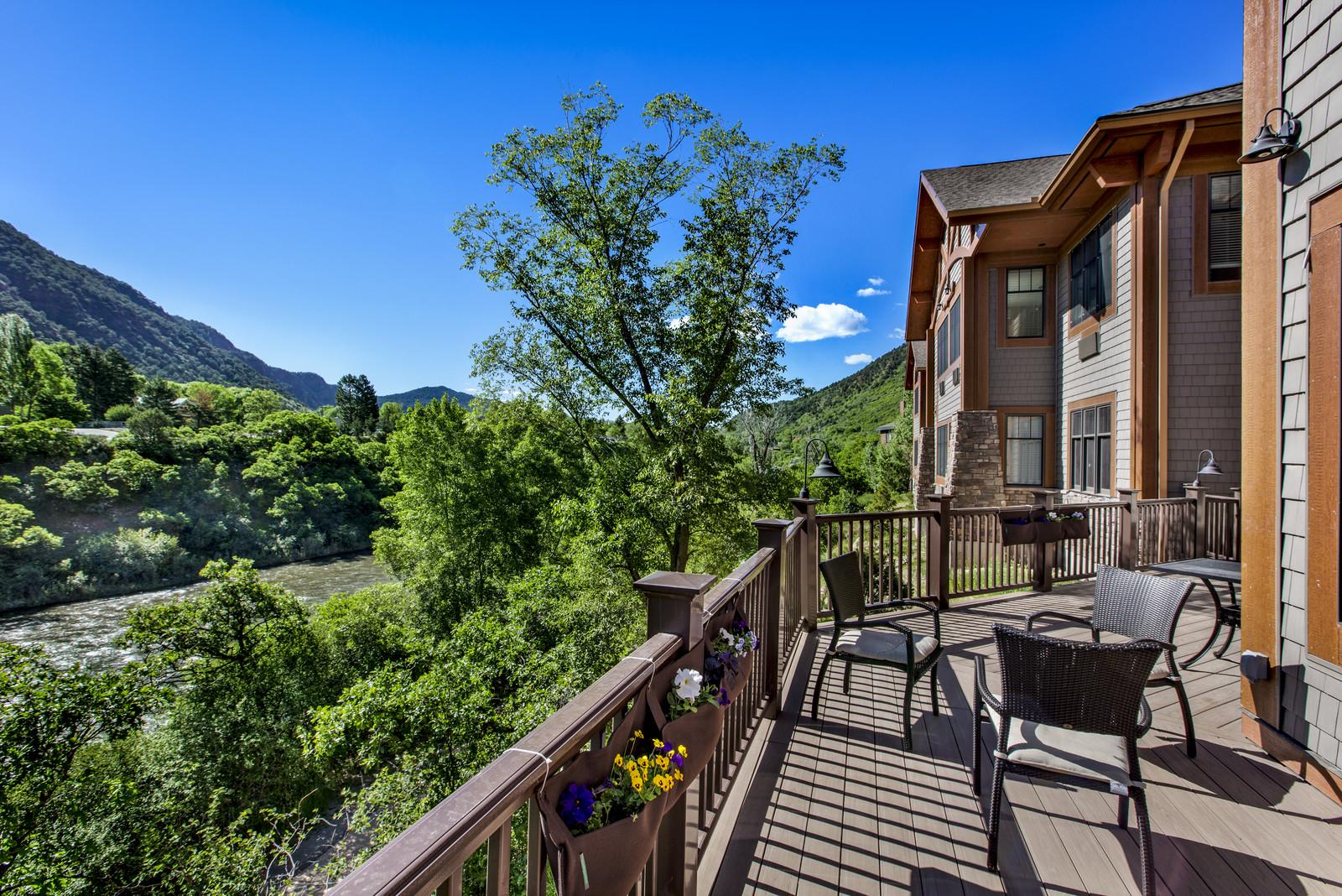An outdoor balcony area of Roaring Fork Senior Living, with a beautiful view of the Roaring Fork River.